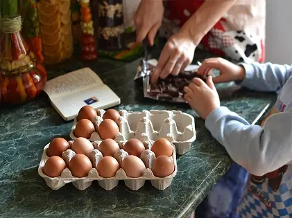 parent and kid preparing food